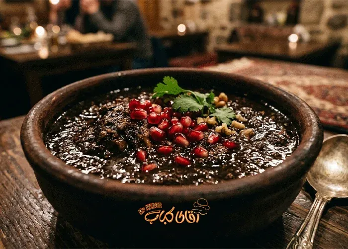 Gilani Fesenjan with its signature dark color and tart flavor.